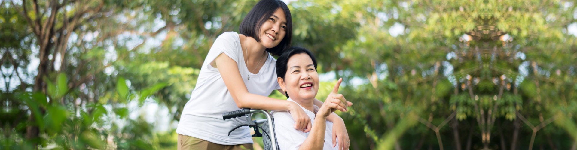 Caregiver with elderly outside