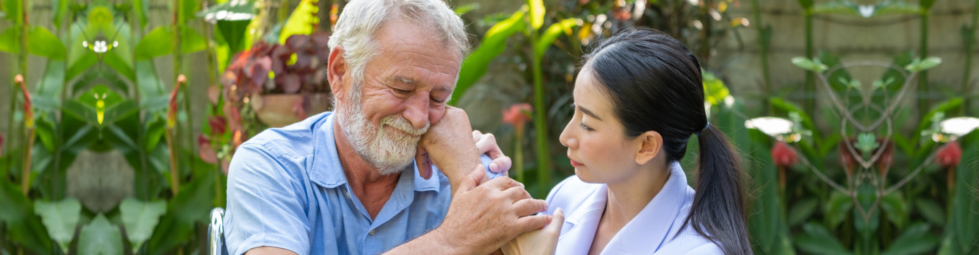 Young nurse take care senior man at home