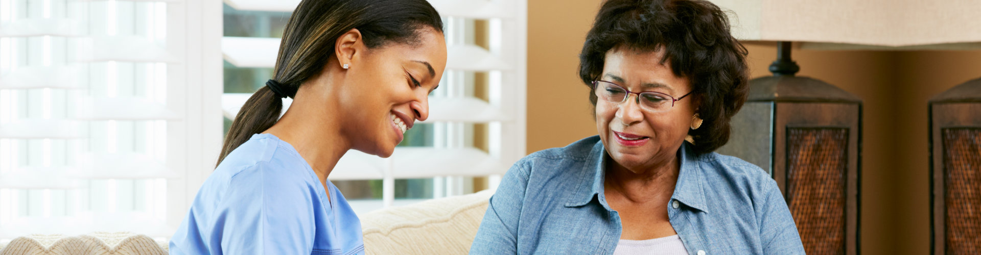 nurse making notes during home visit